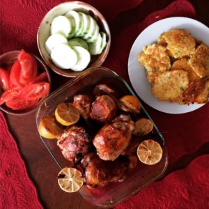 CSA dinner with roasted chicken from Eldridge Farms, jalapeno corn fritters, tomatoes, and cucumbers. 